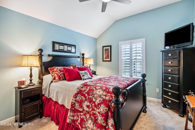 carpeted bedroom featuring ceiling fan and vaulted ceiling