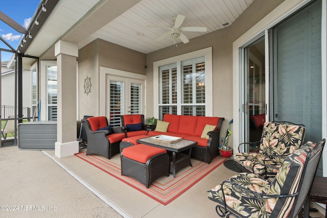 view of patio with an outdoor living space and ceiling fan