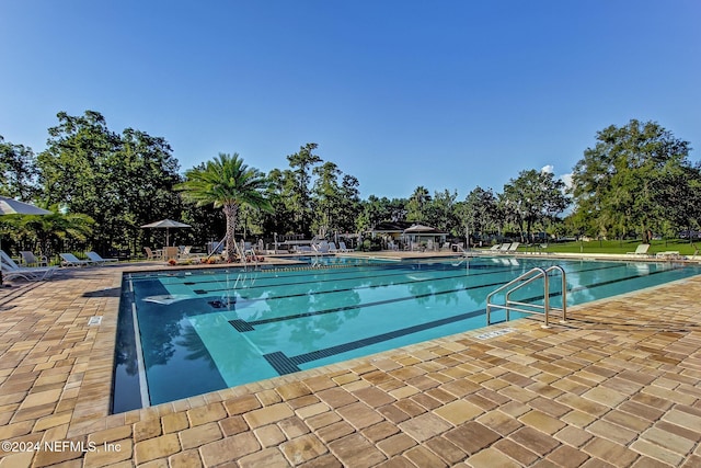 view of pool featuring a patio area