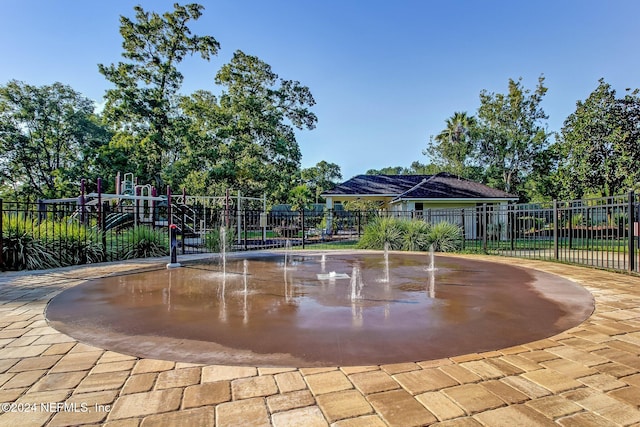 view of home's community featuring a playground