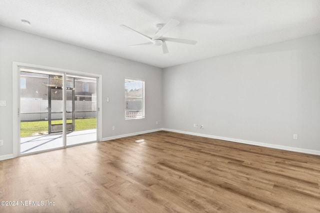 empty room featuring hardwood / wood-style floors and ceiling fan