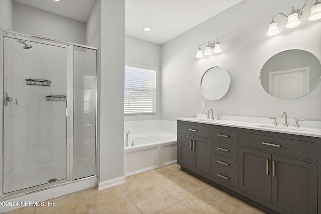 bathroom featuring tile patterned floors, vanity, and separate shower and tub