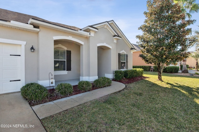 exterior space featuring a front yard and a garage