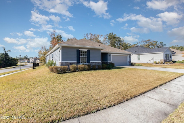 view of front facade featuring a front yard and a garage