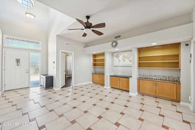 kitchen featuring ceiling fan and built in features