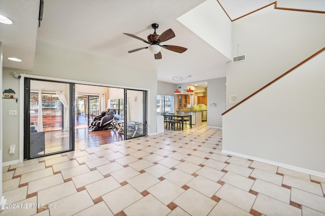 interior space with ceiling fan