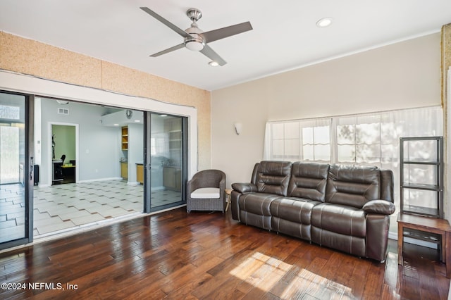 living room featuring ceiling fan, hardwood / wood-style floors, and plenty of natural light