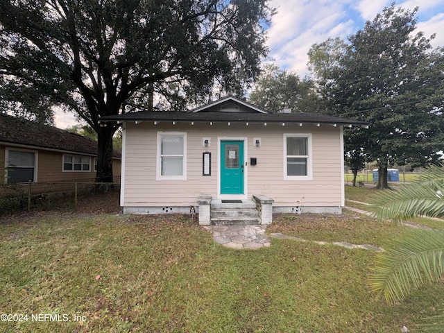 bungalow with a front lawn