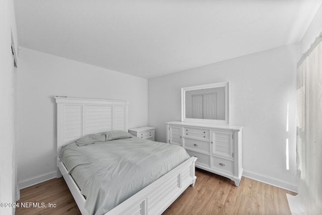 bedroom with light hardwood / wood-style flooring