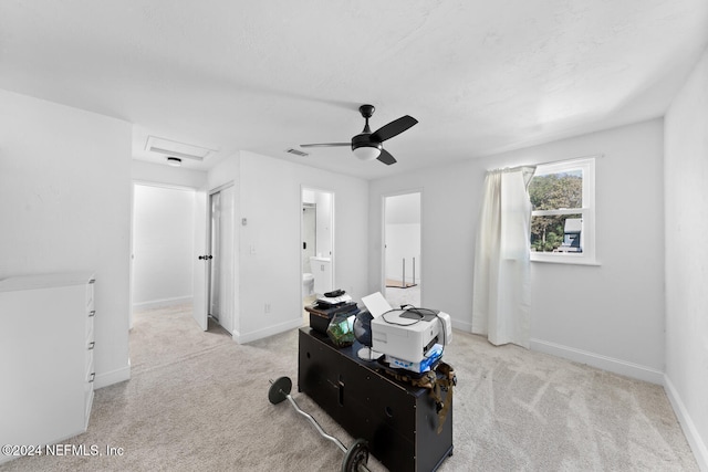 interior space featuring light colored carpet and ceiling fan