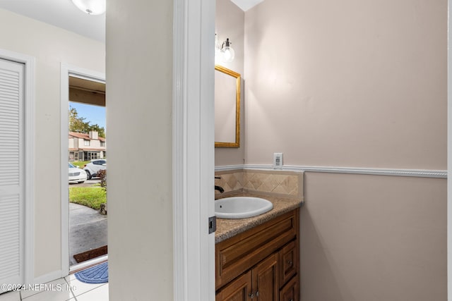 bathroom with tile patterned flooring and vanity