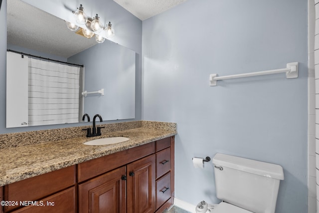 bathroom featuring vanity, a textured ceiling, toilet, and a shower with shower curtain