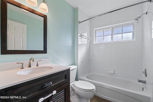 full bathroom with vanity, toilet, and tiled shower / bath