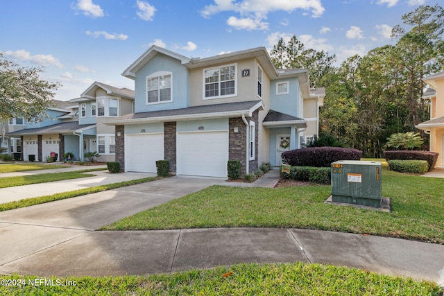 view of front facade featuring a front yard and a garage