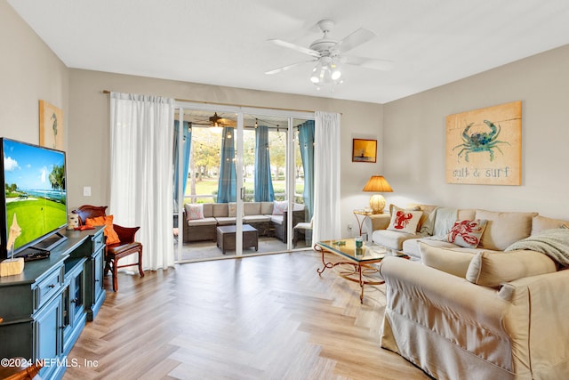 living room featuring ceiling fan and light parquet flooring