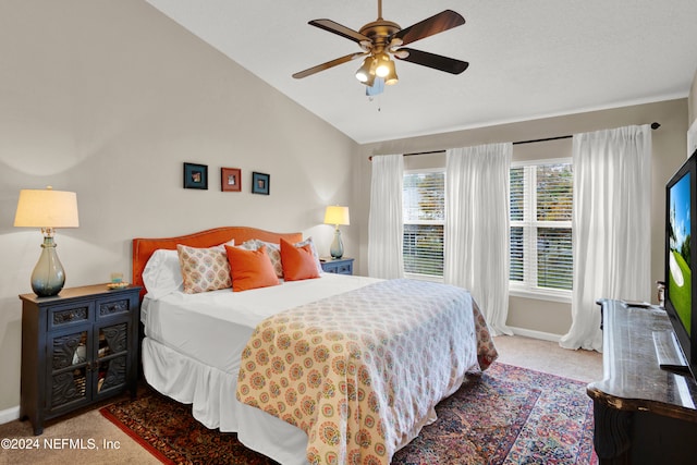 bedroom with light colored carpet, ceiling fan, and lofted ceiling