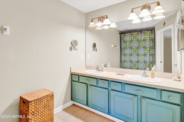 bathroom featuring a shower with curtain, vanity, and tile patterned floors