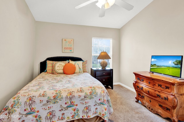 bedroom featuring ceiling fan, light colored carpet, and vaulted ceiling