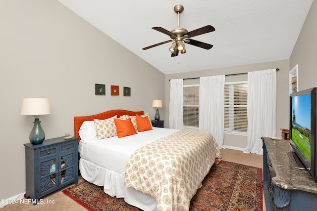 carpeted bedroom featuring vaulted ceiling and ceiling fan