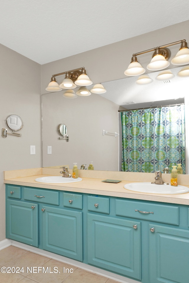 bathroom featuring tile patterned flooring, vanity, and a shower with shower curtain