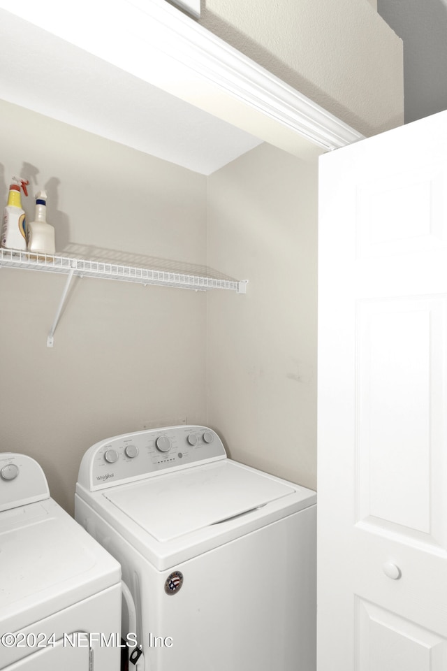 laundry room with separate washer and dryer