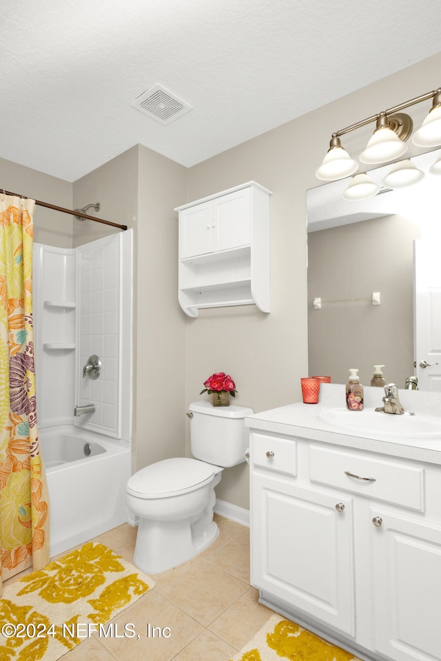 full bathroom with tile patterned floors, vanity, shower / bath combo, and toilet