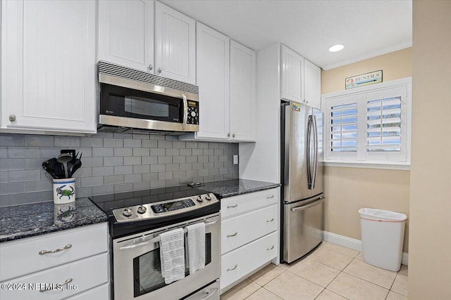 6100 A1A S Unit 419, Saint Augustine, FL 32080 - kitchen featuring stainless steel appliances, white cabinets, light tile patterned floors, and recessed lighting
