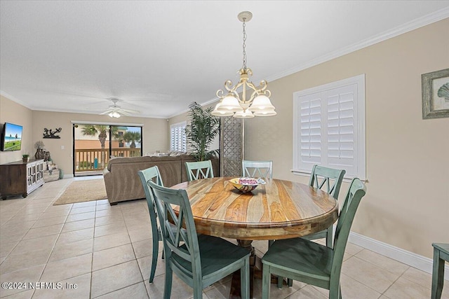 dining area with ceiling fan with notable chandelier, light tile patterned flooring, and crown molding