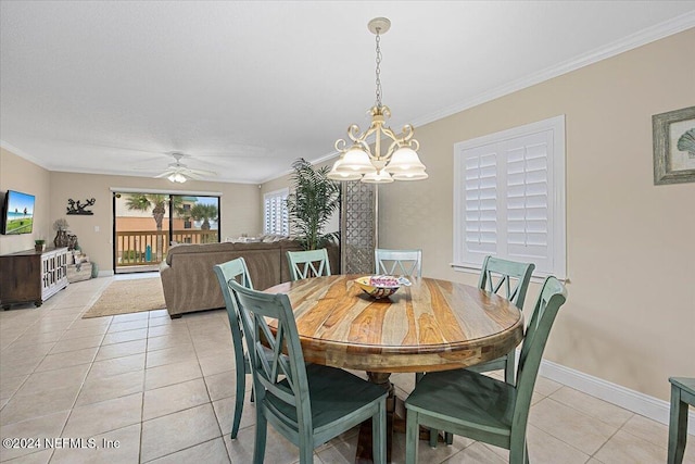 6100 A1A S Unit 419, Saint Augustine, FL 32080 - dining space featuring light tile patterned flooring, a chandelier, crown molding, baseboards, and ceiling fan