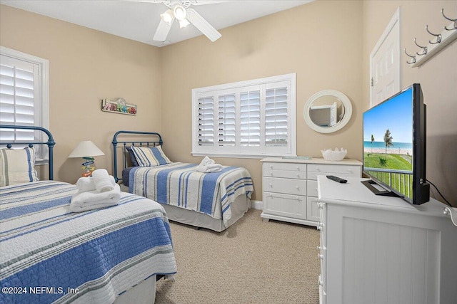 bedroom with ceiling fan and light colored carpet