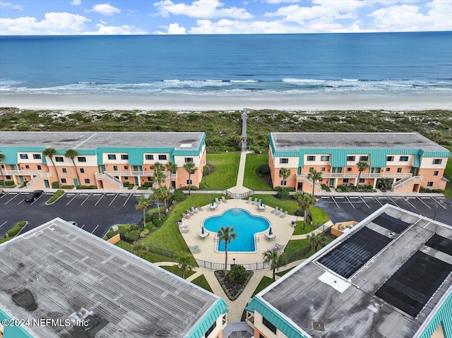 drone / aerial view with a view of the beach and a water view