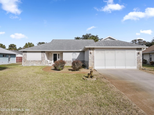 ranch-style home featuring a garage and a front yard