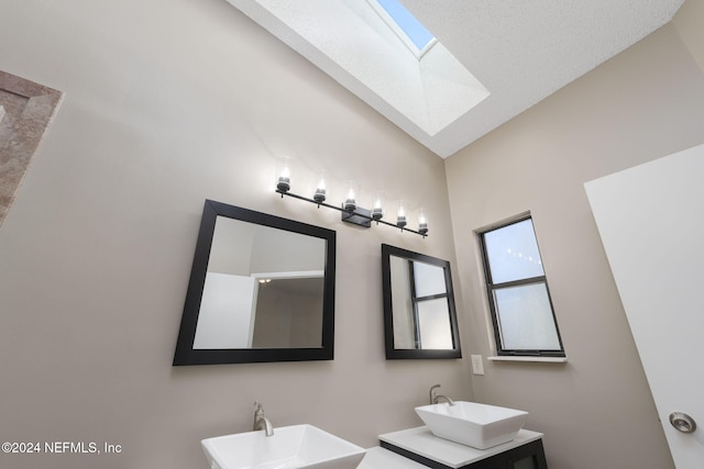 bathroom featuring vanity and vaulted ceiling