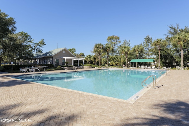 view of pool featuring a patio area