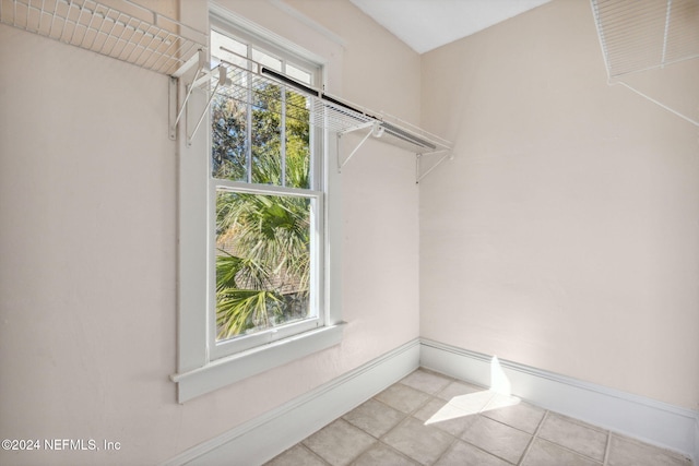 spacious closet featuring light tile patterned floors