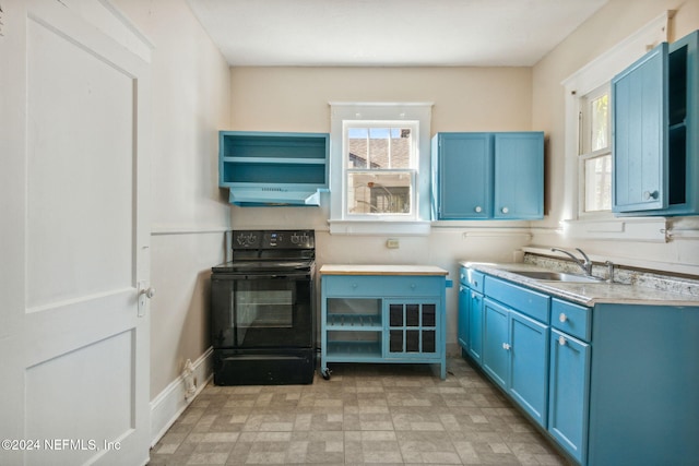 kitchen with black range with electric stovetop, sink, extractor fan, and blue cabinets