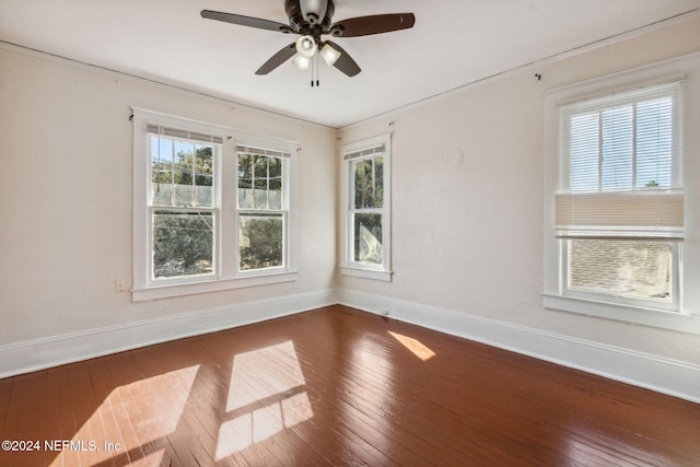 spare room featuring hardwood / wood-style floors and ceiling fan