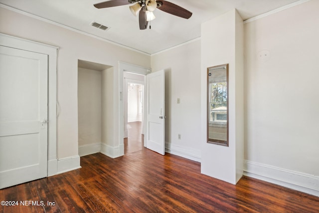 unfurnished bedroom with dark hardwood / wood-style flooring, ceiling fan, and ornamental molding