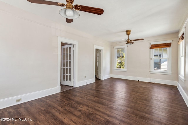 spare room with dark hardwood / wood-style floors