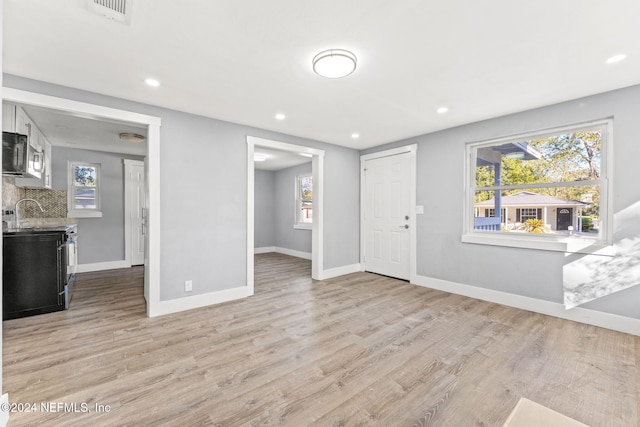 living room with light hardwood / wood-style floors