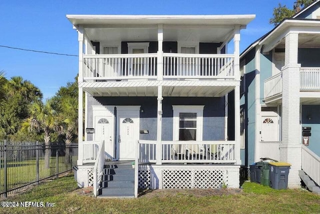 coastal inspired home with a balcony