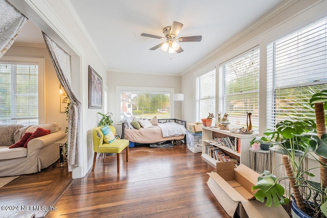 bedroom with ceiling fan, crown molding, and dark hardwood / wood-style floors