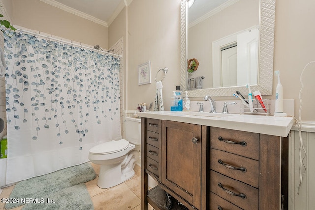 bathroom featuring toilet, vanity, tile patterned floors, and ornamental molding