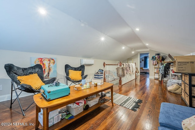 interior space with a wall mounted air conditioner, wood-type flooring, and lofted ceiling