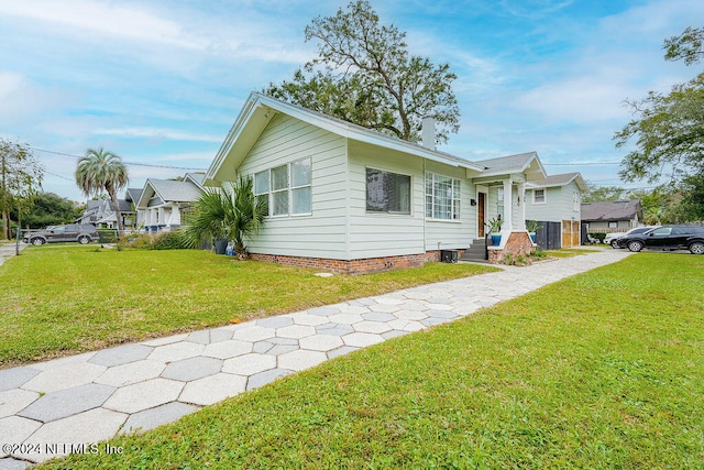 ranch-style house with a front yard