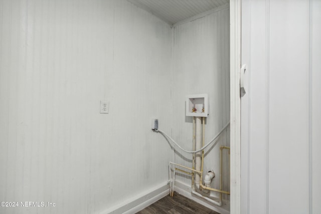 clothes washing area featuring washer hookup and hardwood / wood-style floors