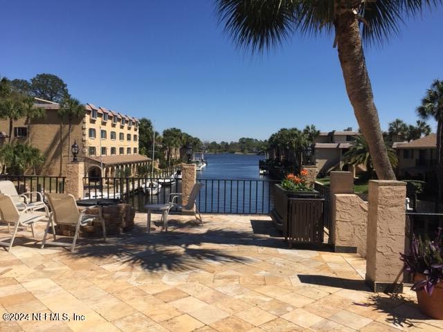 view of patio featuring a water view