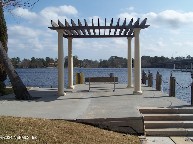 dock area featuring a pergola and a water view