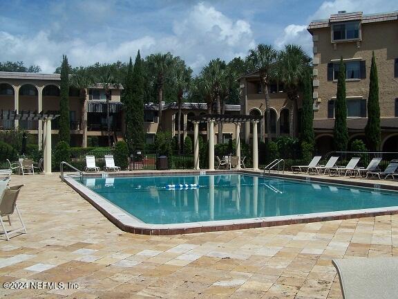 view of pool featuring a patio and a pergola