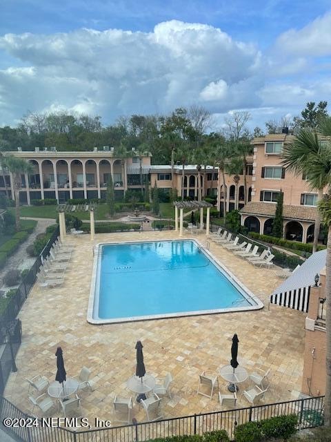 view of swimming pool with a patio